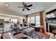 Spacious living room with a fireplace, comfortable seating, and an open layout at 3621 Portland Trail Dr, Suwanee, GA 30024