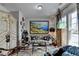 Eclectic living room with unique decor and large windows providing natural light at 3621 Portland Trail Dr, Suwanee, GA 30024