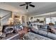 Inviting living room with hardwood floors, ceiling fan, and seamless flow into the bright, modern kitchen at 3621 Portland Trail Dr, Suwanee, GA 30024