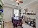A home office features a spacious desk, neutral walls, and good natural light at 3621 Portland Trail Dr, Suwanee, GA 30024