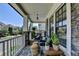 Spacious covered front porch with stone columns, comfortable seating, and views of the neighborhood at 3621 Portland Trail Dr, Suwanee, GA 30024