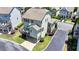 Exterior aerial view of a two-story home highlighting a deck and manicured lawn at 3621 Portland Trail Dr, Suwanee, GA 30024