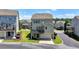 Rear view of home features deck, lush landscaping, and a convenient two-car garage at 3621 Portland Trail Dr, Suwanee, GA 30024