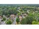 Community aerial shows mature trees, well-maintained lawns, and neighborhood street layout at 107 Mary Gay Ct, Decatur, GA 30030