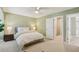 Carpeted bedroom featuring a bed and doorway to the bathroom at 107 Mary Gay Ct, Decatur, GA 30030