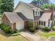 Charming two-story home with brick and siding, attached garage, and manicured landscaping at 107 Mary Gay Ct, Decatur, GA 30030
