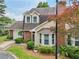 Inviting two-story home featuring a brick facade, bay windows, and a well-maintained lawn at 107 Mary Gay Ct, Decatur, GA 30030