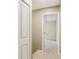 Neutral hallway with neutral carpet leading into a room with an open door at 107 Mary Gay Ct, Decatur, GA 30030