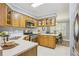 Bright eat-in kitchen with stainless steel appliances, wood cabinetry, and ample counter space at 107 Mary Gay Ct, Decatur, GA 30030