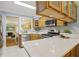 Updated kitchen features quartz countertops, stainless steel appliances, and wood cabinets at 107 Mary Gay Ct, Decatur, GA 30030