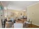Bright and airy living room showcasing hardwood floors, neutral decor, and seamless access to the dining area at 107 Mary Gay Ct, Decatur, GA 30030
