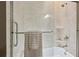 A bright shower space with white tiles, glass doors, and silver hardware at 107 Mary Gay Ct, Decatur, GA 30030