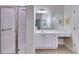 Elegant bathroom featuring a shower with glass door and a vanity with plenty of counter space at 1301 Haven Cir, Douglasville, GA 30135