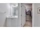 Serene bathroom featuring a vanity and an open doorway to a walk-in closet at 1301 Haven Cir, Douglasville, GA 30135