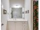 Bathroom vanity with modern fixtures, large mirror, and neutral tones create a calming and pleasant space at 1301 Haven Cir, Douglasville, GA 30135