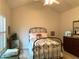 Bright bedroom with high ceilings, shuttered windows, and a decorative metal bed frame at 1301 Haven Cir, Douglasville, GA 30135