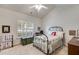 Comfortable bedroom showcasing a metal bed frame, shuttered window, and neutral decor at 1301 Haven Cir, Douglasville, GA 30135