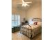 Cozy bedroom featuring high ceilings, shuttered windows, and a decorative metal bed frame at 1301 Haven Cir, Douglasville, GA 30135