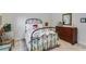 Charming bedroom featuring a metal bed frame, neutral walls, and comfortable furnishings at 1301 Haven Cir, Douglasville, GA 30135