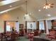 Spacious clubhouse with vaulted ceilings, ceiling fans, and several tables and chairs at 1301 Haven Cir, Douglasville, GA 30135