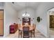 Elegant dining room featuring a chandelier, hardwood table, and ornate china cabinet at 1301 Haven Cir, Douglasville, GA 30135