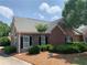 Charming brick home with stone accents, manicured landscaping, and a lush green lawn at 1301 Haven Cir, Douglasville, GA 30135