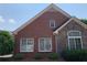 Exterior view of a brick and stone home with a well-kept lawn at 1301 Haven Cir, Douglasville, GA 30135