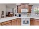 Stylish kitchen boasting wood cabinets, stainless appliances and neutral countertops at 1301 Haven Cir, Douglasville, GA 30135