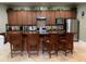 Well-equipped kitchen featuring updated appliances, wooden cabinets and an island with bar stool seating at 1301 Haven Cir, Douglasville, GA 30135