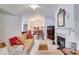 Spacious living room with fireplace, vaulted ceilings, and views of the dining area at 1301 Haven Cir, Douglasville, GA 30135