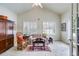 Bright living room with vaulted ceiling, shuttered windows, and neutral decor at 1301 Haven Cir, Douglasville, GA 30135