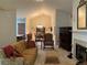 Spacious living room showcasing fireplace, vaulted ceiling and elegant dining area at 1301 Haven Cir, Douglasville, GA 30135