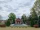 Beautiful community pool house with a fenced in pool and mature landscaping at 1301 Haven Cir, Douglasville, GA 30135