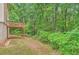 Backyard view of wooden deck and beautiful greenery create a tranquil retreat at 3599 Brookstone Way, Union City, GA 30291