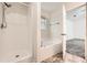 Bathroom featuring walk-in shower, separate soaking tub, and neutral tile floor at 3599 Brookstone Way, Union City, GA 30291