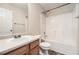 Full bathroom showcases a tub with shower, single sink vanity, toilet, and modern fixtures at 3599 Brookstone Way, Union City, GA 30291