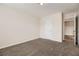Neutral bedroom features plush carpet, a closet, and white walls, creating a serene and inviting space at 3599 Brookstone Way, Union City, GA 30291