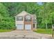 Charming two-story home with a two-car garage and a well-maintained front yard at 3599 Brookstone Way, Union City, GA 30291