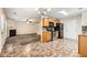Open eat-in kitchen with stainless steel appliances flows to living room at 3599 Brookstone Way, Union City, GA 30291