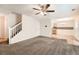 Open-concept living room leading to dining area, featuring stairs and neutral colors at 3599 Brookstone Way, Union City, GA 30291