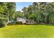 A spacious backyard with lush green grass and well-maintained landscaping, offering ample space for outdoor activities at 5219 Legendary Ln, Acworth, GA 30102