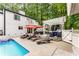 An incredible backyard with a pool, pergola, and lounge seating, perfect for enjoying outdoor living at its finest at 5219 Legendary Ln, Acworth, GA 30102