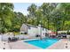 A refreshing backyard pool with lounge chairs and an outdoor dining area, perfect for relaxation and entertaining at 5219 Legendary Ln, Acworth, GA 30102
