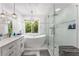 Bright modern bathroom with separate tub and glass enclosed shower at 5219 Legendary Ln, Acworth, GA 30102