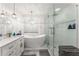 Modern bathroom featuring soaking tub, glass shower, and sleek vanity at 5219 Legendary Ln, Acworth, GA 30102