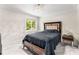 Bedroom featuring a plush bed, marble floors, and bright natural light at 5219 Legendary Ln, Acworth, GA 30102