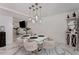 Bright dining room with modern lighting, white plank walls, and marble floors at 5219 Legendary Ln, Acworth, GA 30102