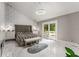 Modern main bedroom featuring sleek floors, detailed wall, and access to balcony at 5219 Legendary Ln, Acworth, GA 30102