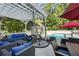 Inviting outdoor living space with comfortable seating, a hanging chair, and a view of the refreshing pool at 5219 Legendary Ln, Acworth, GA 30102