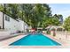 In-ground pool with privacy fence, pergola and outdoor lounge chairs at 5219 Legendary Ln, Acworth, GA 30102